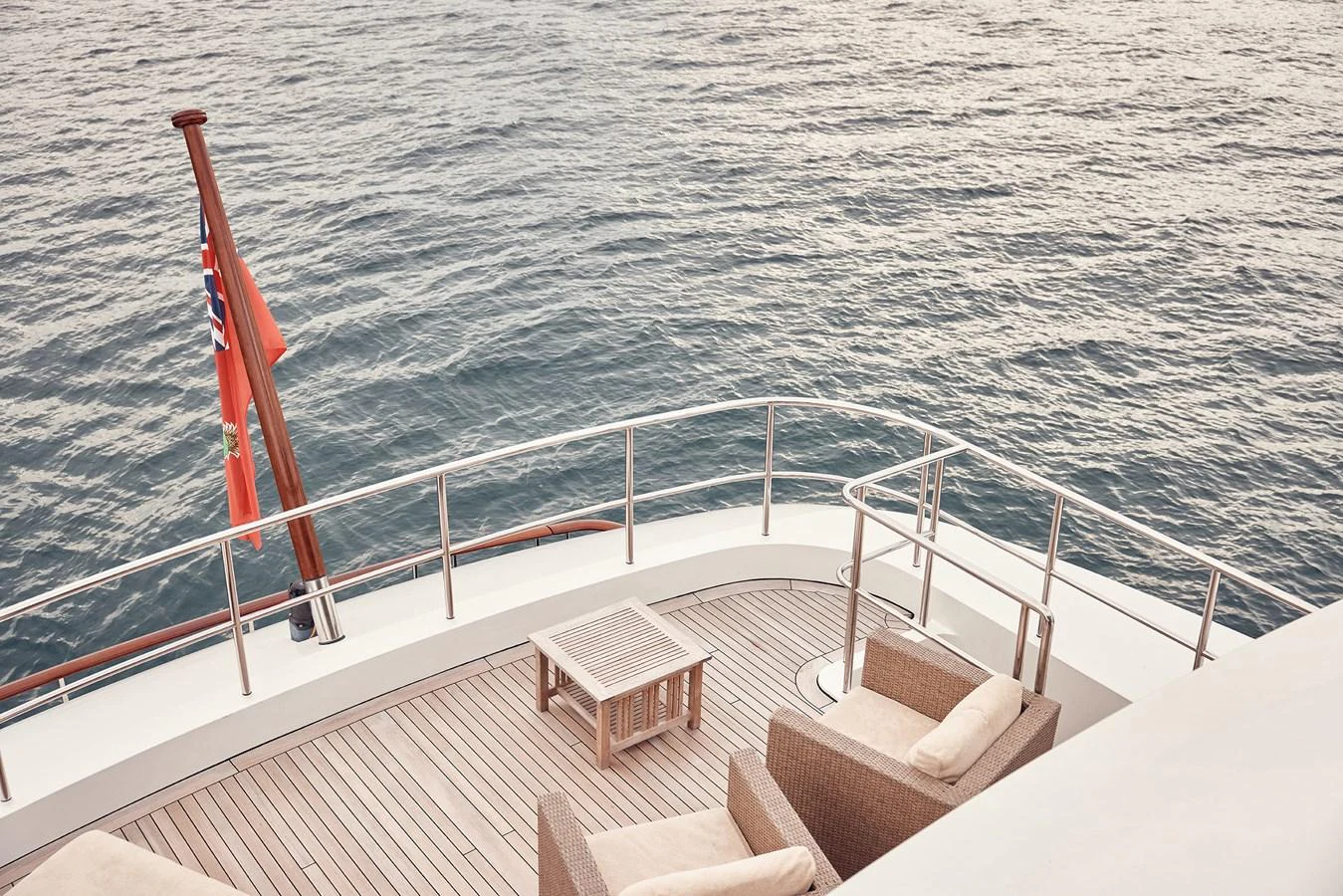 The aft deck offers a serene seating area with a stunning view of the open water. aboard BELUGA Yacht for Sale