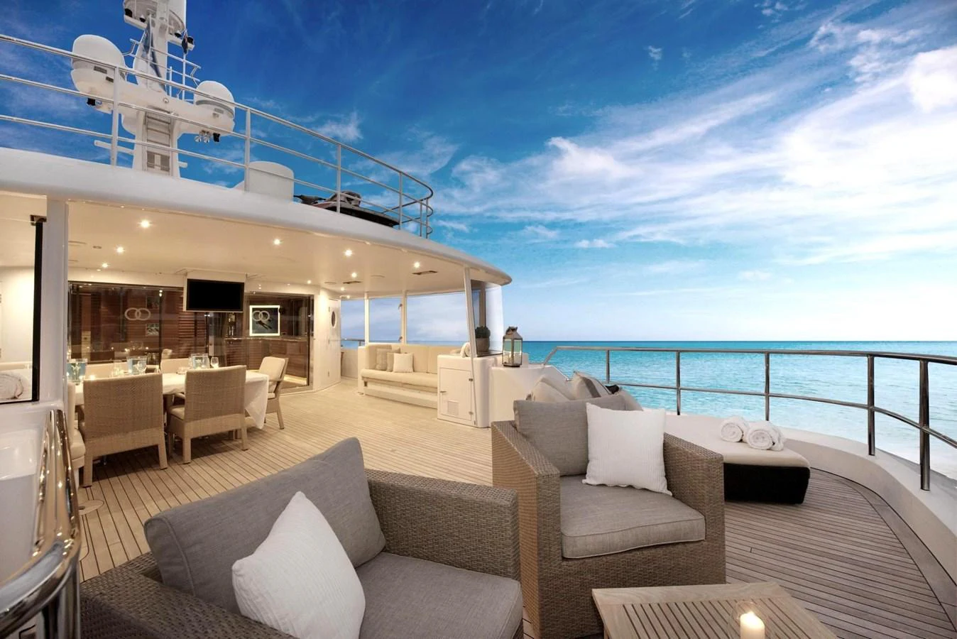 The aft deck offers a luxurious outdoor living space with comfortable seating and stunning ocean views. aboard BELUGA Yacht for Sale