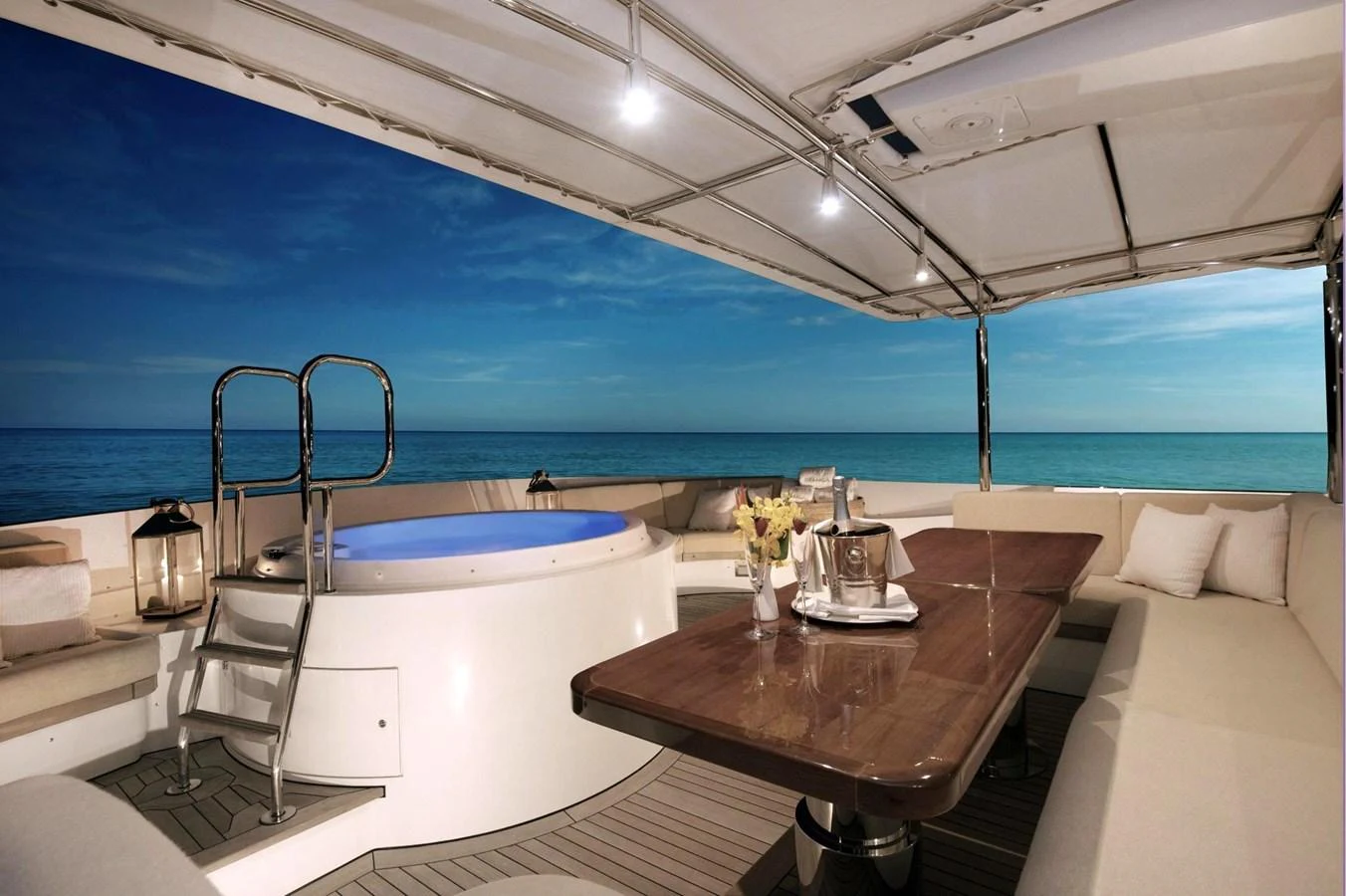 The aft deck features a luxurious hot tub and a spacious dining area with stunning ocean views. aboard BELUGA Yacht for Sale