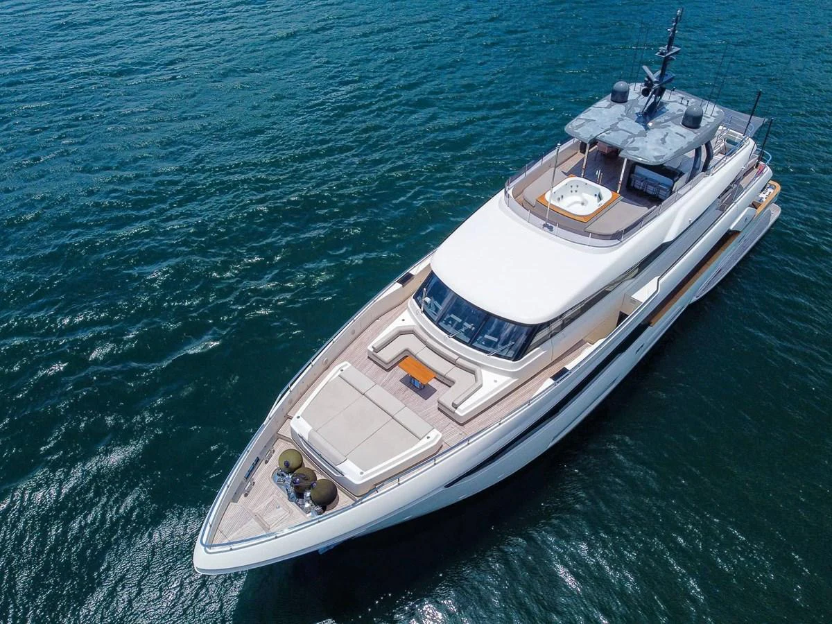 A sleek and modern yacht glides gracefully on the water, showcasing its elegant design and spacious deck areas. aboard CUSTOM LINE NAVETTA 33 Yacht for Sale