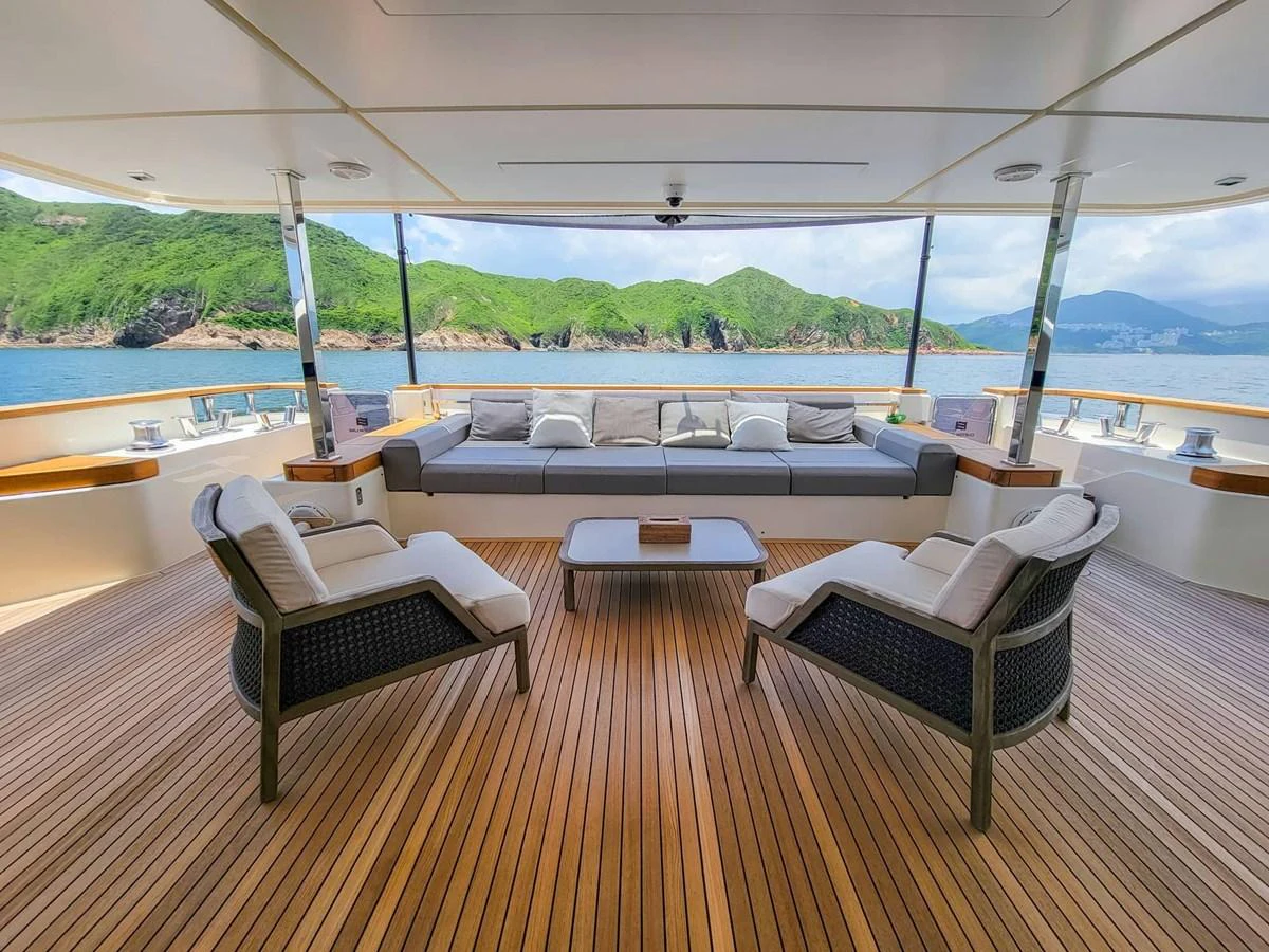 The aft deck offers a spacious and inviting seating area with stunning views of the surrounding waters and landscape. aboard CUSTOM LINE NAVETTA 33 Yacht for Sale