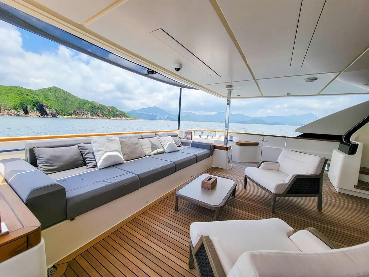 The aft deck features a spacious seating area with comfortable cushions and a stunning view of the water. aboard CUSTOM LINE NAVETTA 33 Yacht for Sale
