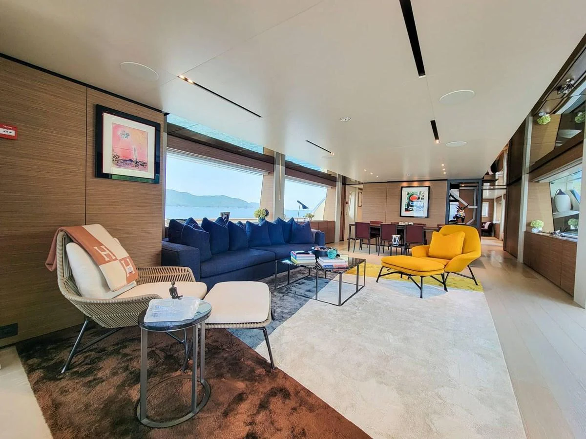 The spacious salon features modern furnishings and large windows offering panoramic views. aboard CUSTOM LINE NAVETTA 33 Yacht for Sale