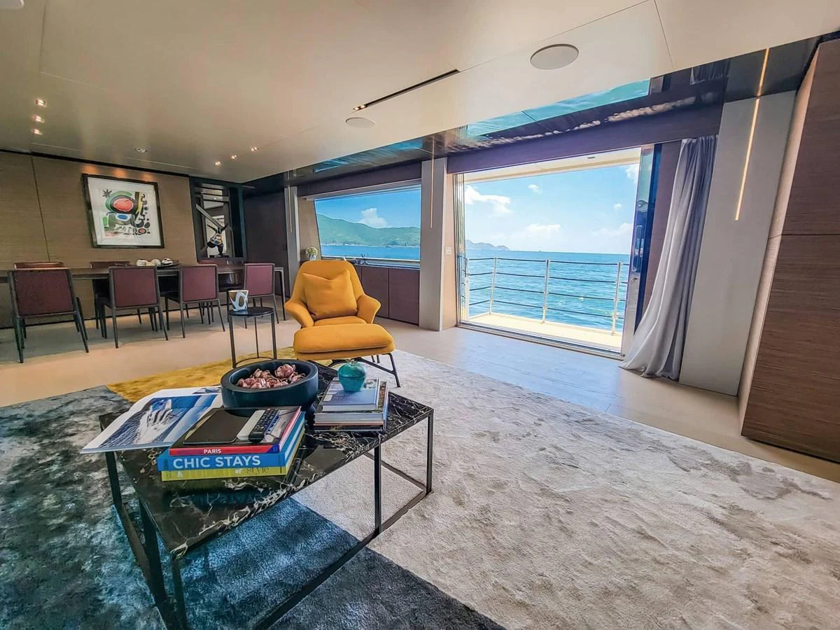 The salon offers a luxurious and spacious area with a stunning view of the ocean. aboard CUSTOM LINE NAVETTA 33 Yacht for Sale