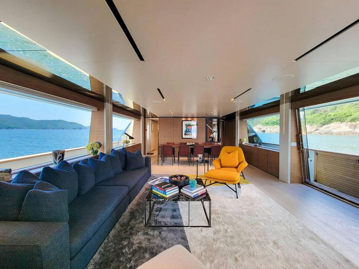 The spacious salon features modern furnishings with panoramic views of the sea. aboard CUSTOM LINE NAVETTA 33 Yacht for Sale