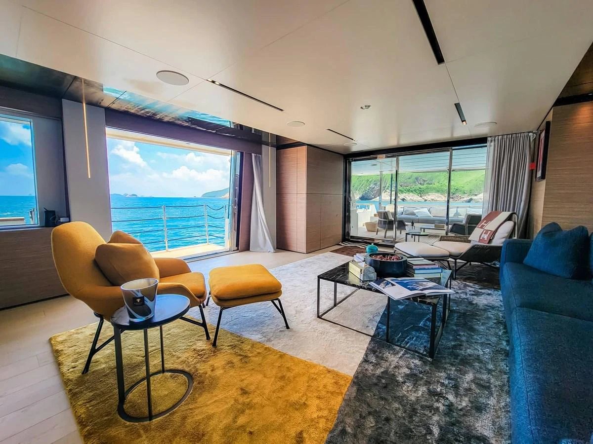 The salon offers a spacious and luxurious area with comfortable seating and stunning ocean views. aboard CUSTOM LINE NAVETTA 33 Yacht for Sale