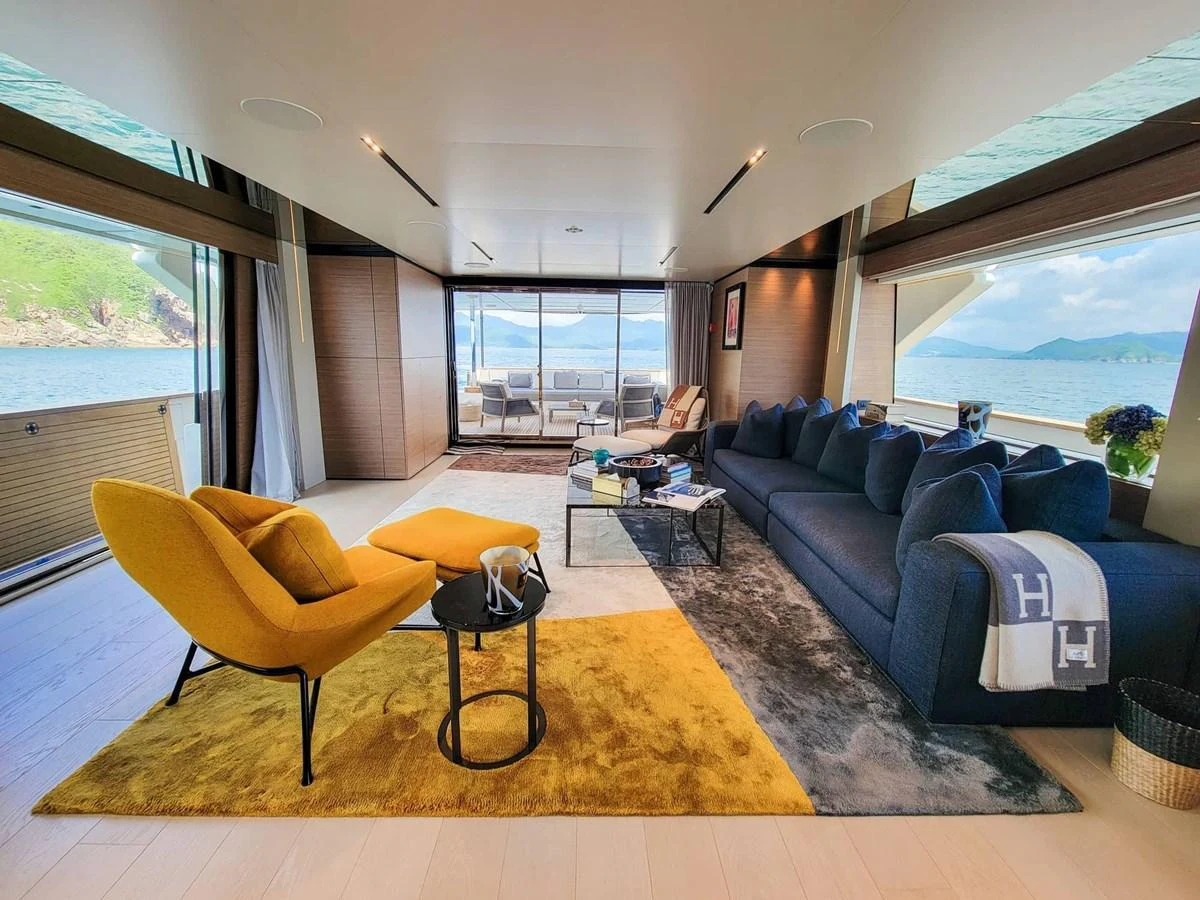 The salon offers a spacious and luxurious seating area with panoramic views of the surrounding waters. aboard CUSTOM LINE NAVETTA 33 Yacht for Sale