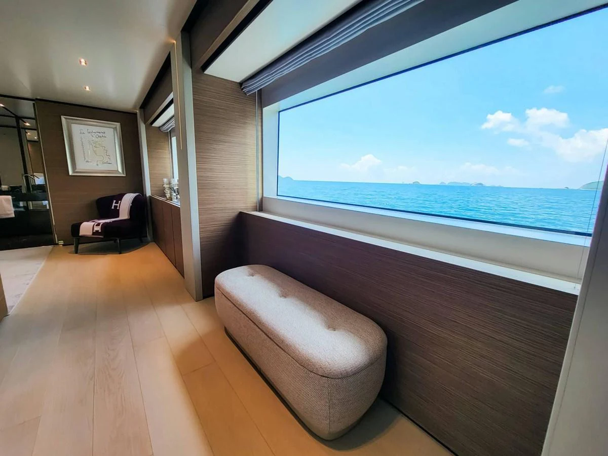 A serene interior space with a large window offering a stunning ocean view. aboard CUSTOM LINE NAVETTA 33 Yacht for Sale