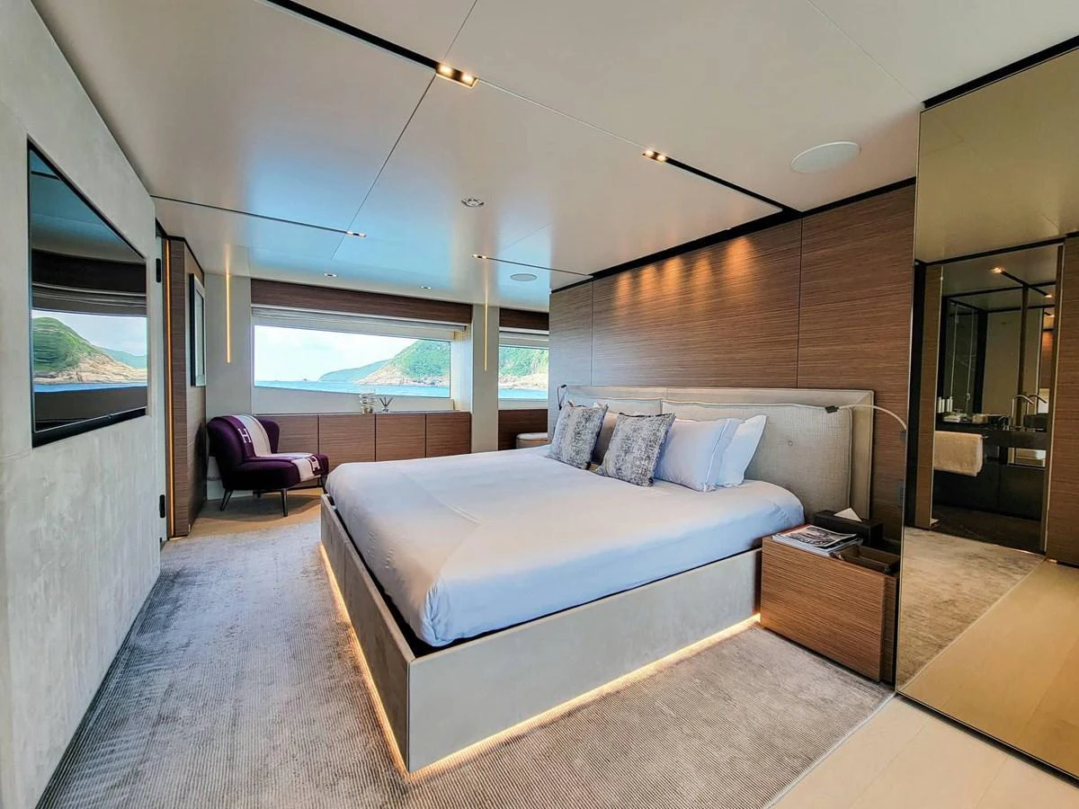 The master stateroom offers a luxurious and spacious retreat with stunning views through large windows. aboard CUSTOM LINE NAVETTA 33 Yacht for Sale