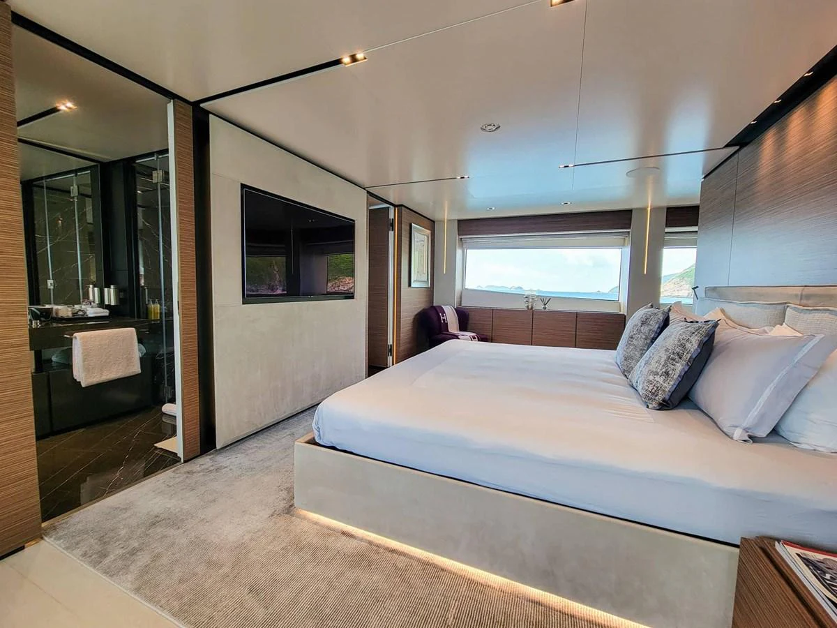 The master stateroom offers a luxurious and spacious retreat with modern amenities and stunning views. aboard CUSTOM LINE NAVETTA 33 Yacht for Sale
