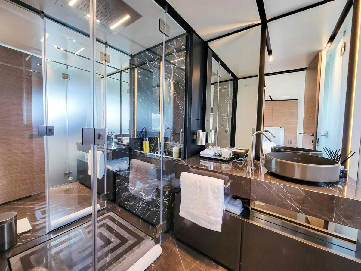 The yacht's bathroom features a sleek, modern design with luxurious finishes and ample space. aboard CUSTOM LINE NAVETTA 33 Yacht for Sale