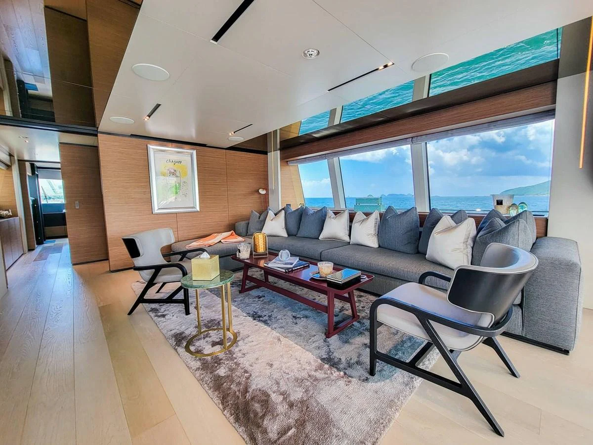 The salon offers a spacious and luxurious seating area with panoramic ocean views. aboard CUSTOM LINE NAVETTA 33 Yacht for Sale