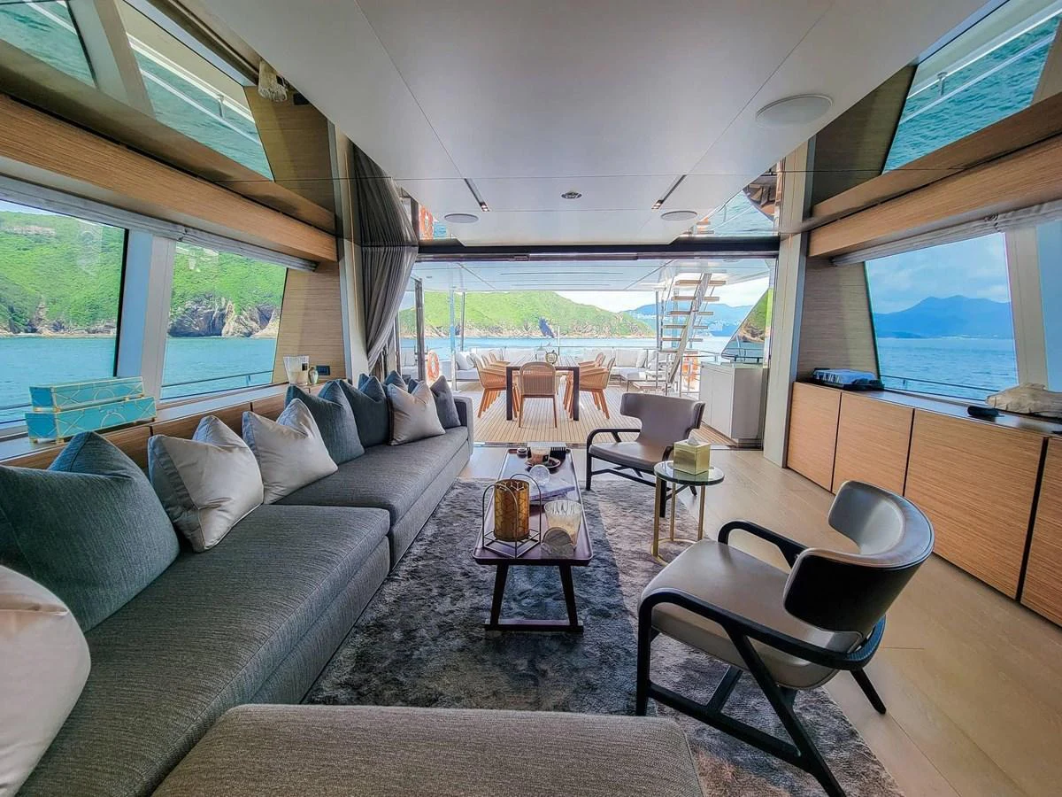 The salon offers a spacious and luxurious seating area with panoramic views of the surrounding waters. aboard CUSTOM LINE NAVETTA 33 Yacht for Sale