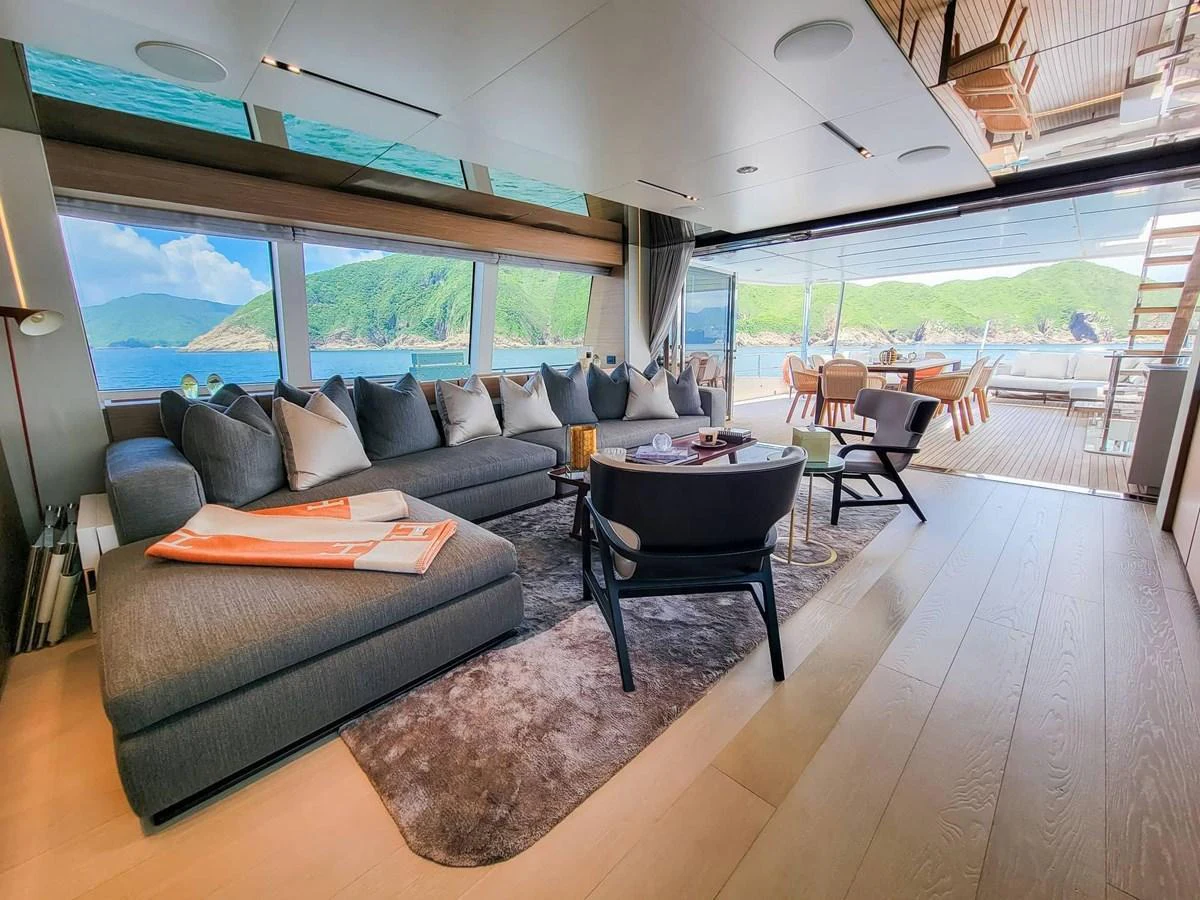 The salon offers a spacious and luxurious seating area with panoramic views of the surrounding waters. aboard CUSTOM LINE NAVETTA 33 Yacht for Sale