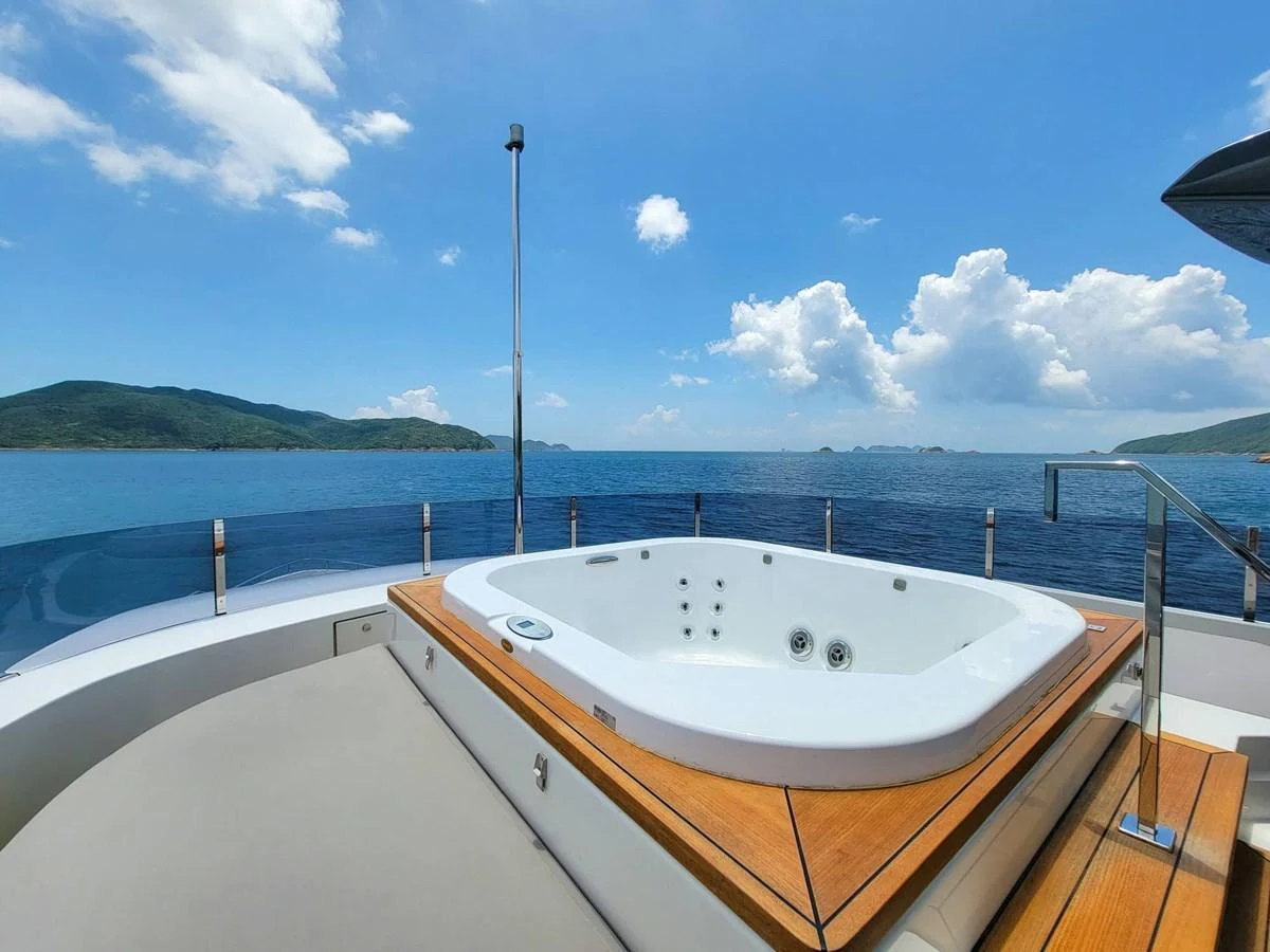 A luxurious jacuzzi on the deck offers stunning ocean views. aboard CUSTOM LINE NAVETTA 33 Yacht for Sale