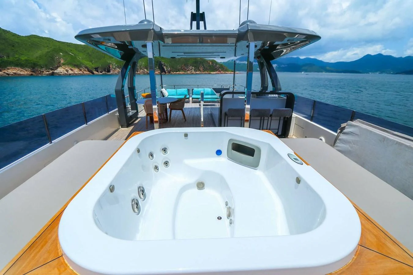 The sundeck features a luxurious jacuzzi with stunning views of the surrounding waters. aboard CUSTOM LINE NAVETTA 33 Yacht for Sale