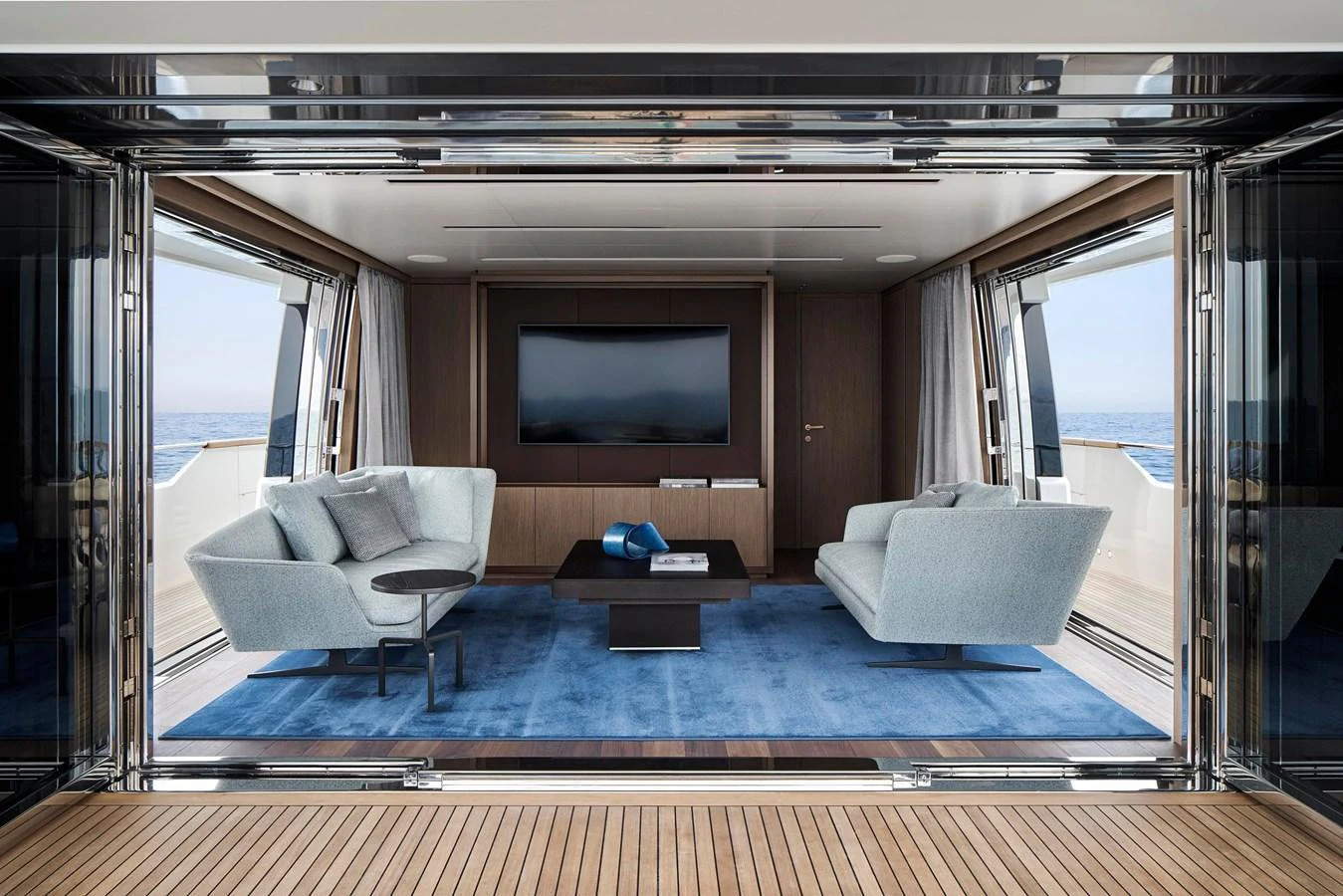 The salon offers a luxurious and spacious area with modern furnishings and a stunning sea view. aboard SANLORENZO SD96 Yacht for Sale