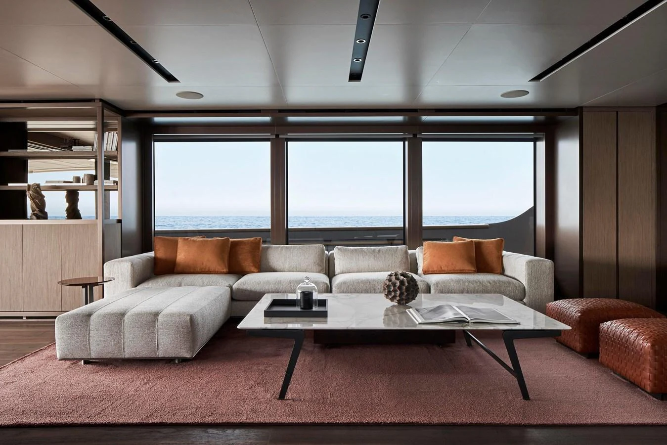 The salon features a modern and elegant design with a comfortable seating area and panoramic ocean views. aboard SANLORENZO SD96 Yacht for Sale