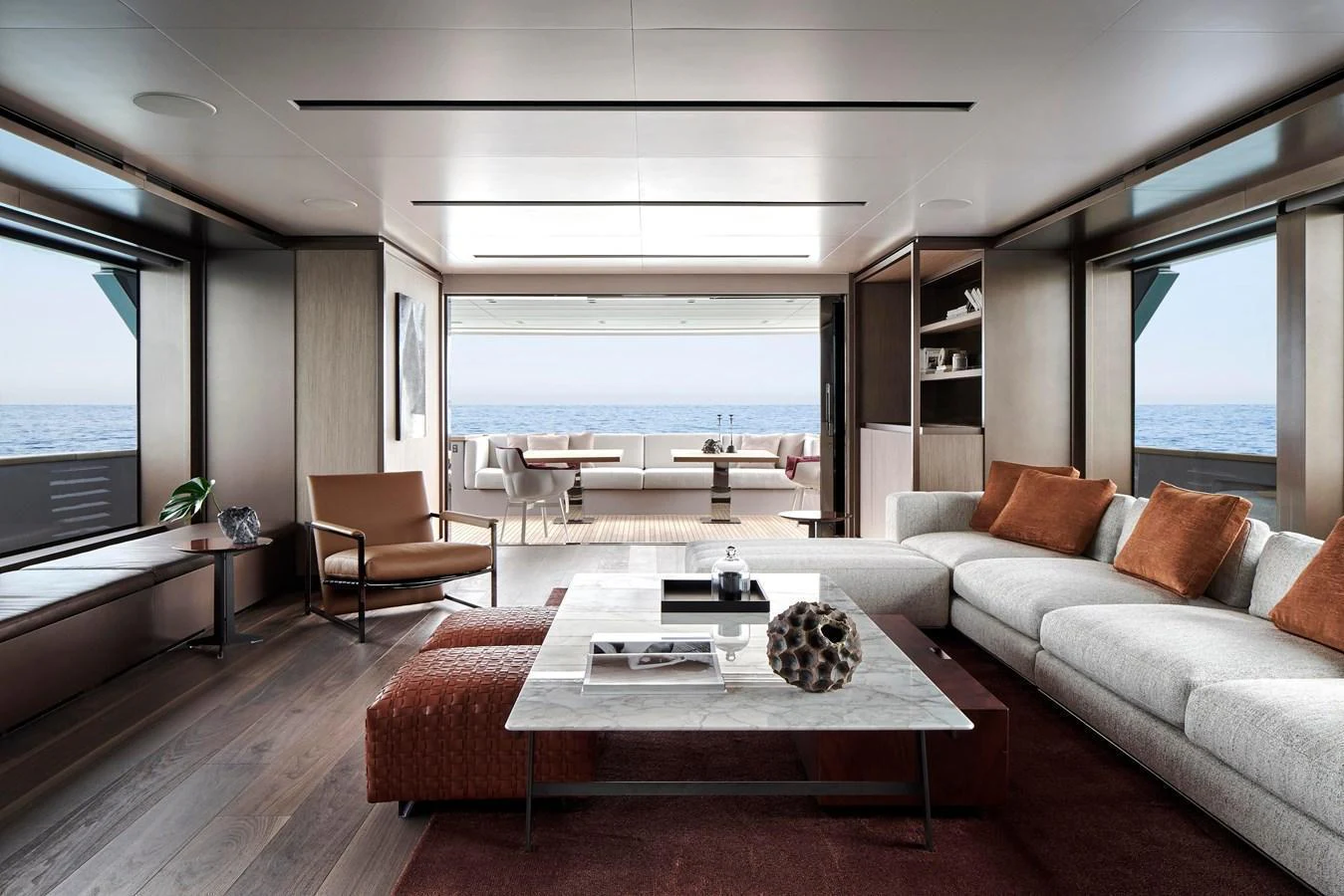 The salon offers a spacious and elegant living area with modern furnishings and a stunning view of the sea. aboard SANLORENZO SD96 Yacht for Sale