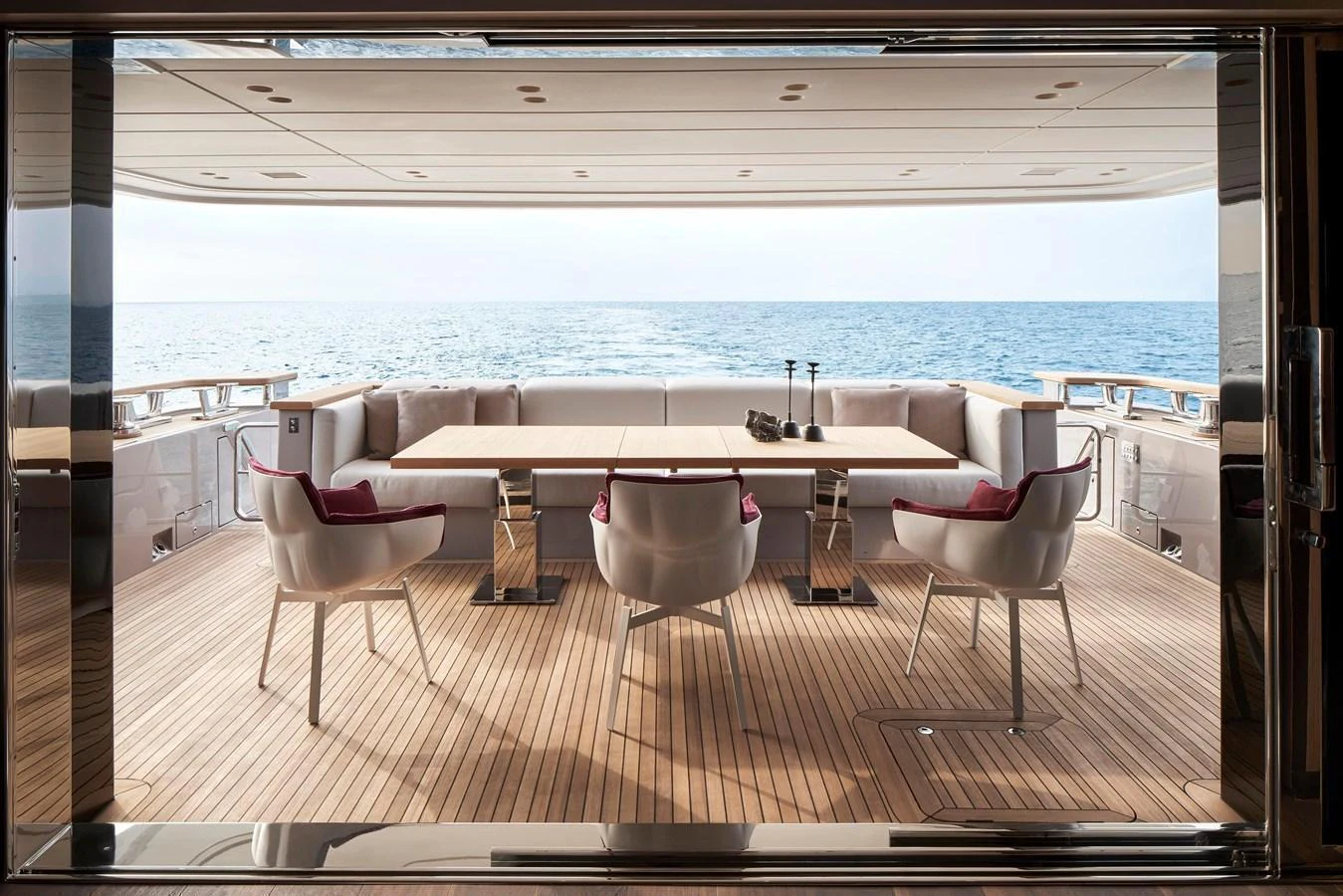 The aft deck features a spacious dining area with a stunning sea view. aboard SANLORENZO SD96 Yacht for Sale