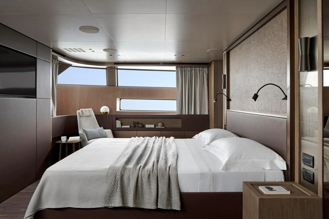 The stateroom features a luxurious bed with elegant linens and modern decor, offering a serene retreat. aboard SANLORENZO SD96 Yacht for Sale