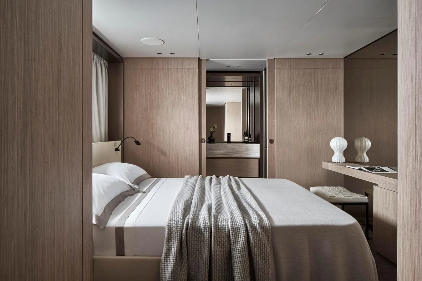 A serene and elegantly designed stateroom with a cozy bed and modern decor. aboard SANLORENZO SD96 Yacht for Sale