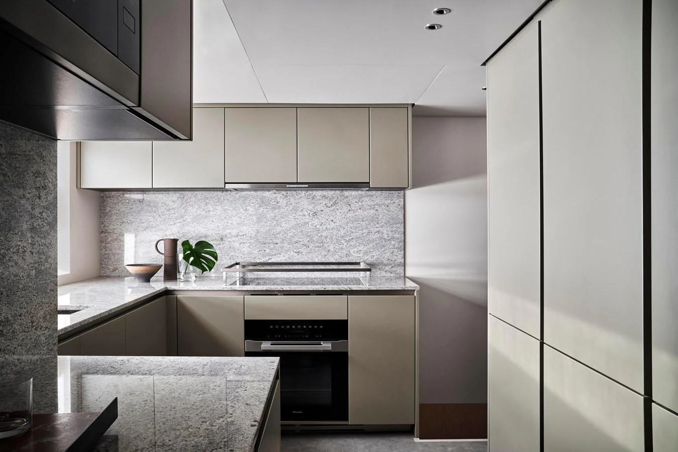 The yacht's galley features sleek, modern cabinetry and high-end appliances, creating a sophisticated culinary space. aboard SANLORENZO SD96 Yacht for Sale