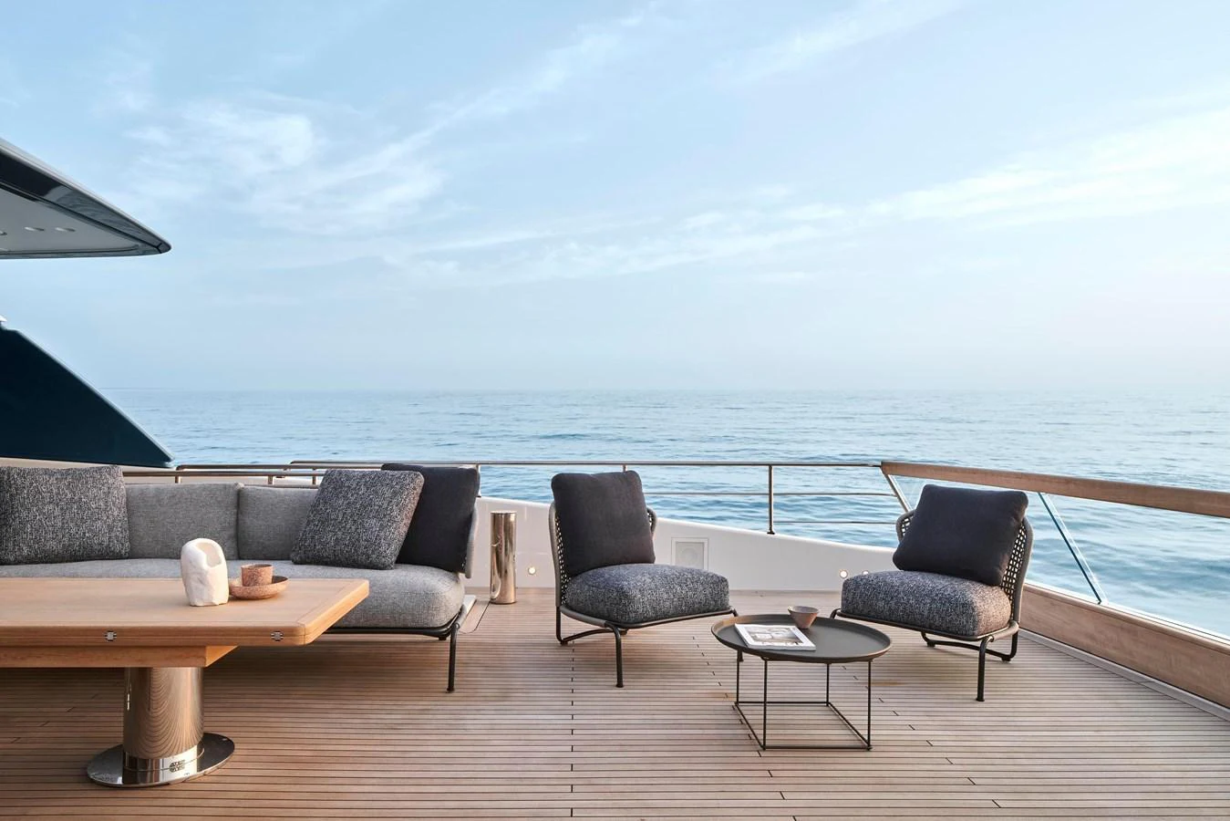 The aft deck offers a serene outdoor lounging area with comfortable seating and a stunning ocean view. aboard SANLORENZO SD96 Yacht for Sale