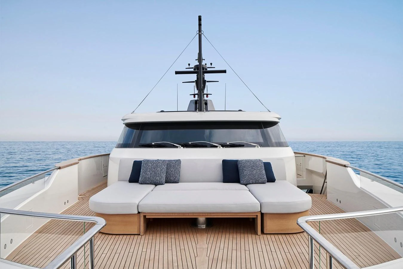 The yacht's foredeck features a spacious seating area with plush cushions, perfect for relaxation. aboard SANLORENZO SD96 Yacht for Sale