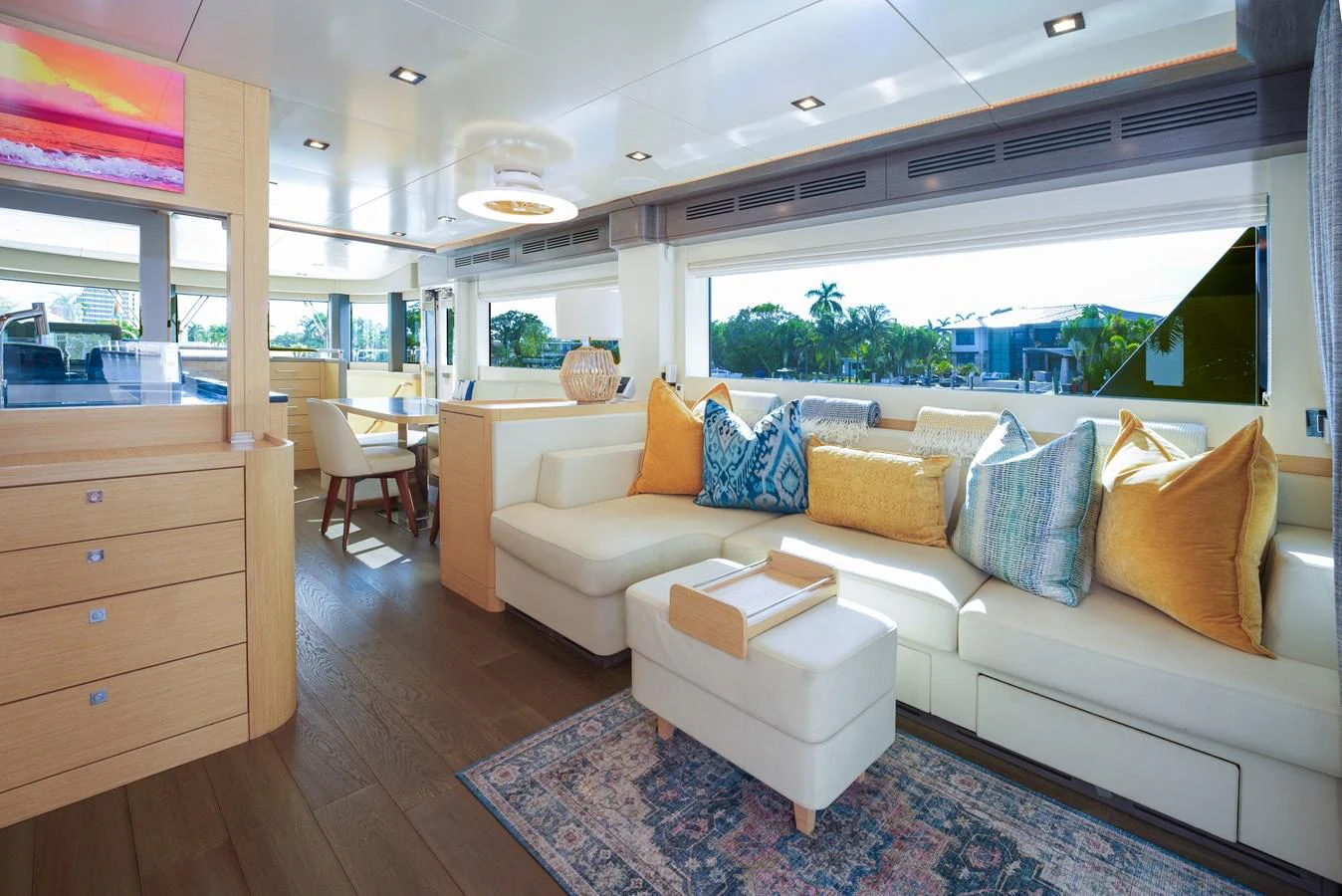 The salon features a spacious seating area with plush cushions and ample natural light. aboard FANTASEA Yacht for Sale