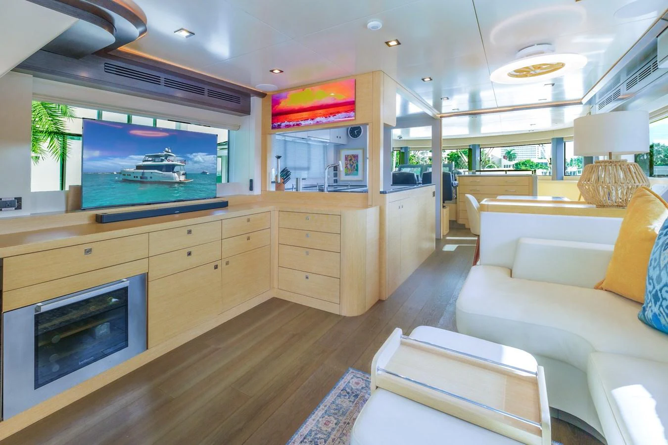 The yacht's salon features a spacious and modern design with ample natural light and luxurious furnishings. aboard FANTASEA Yacht for Sale