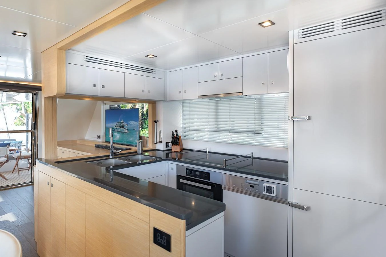 The yacht's galley features modern appliances and ample counter space, perfect for gourmet meal preparation. aboard FANTASEA Yacht for Sale
