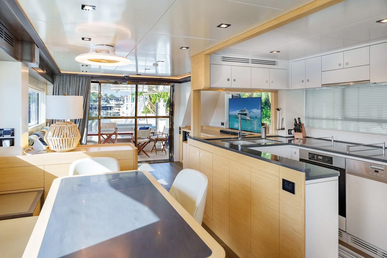The yacht's galley features modern appliances and a spacious dining area with ample natural light. aboard FANTASEA Yacht for Sale