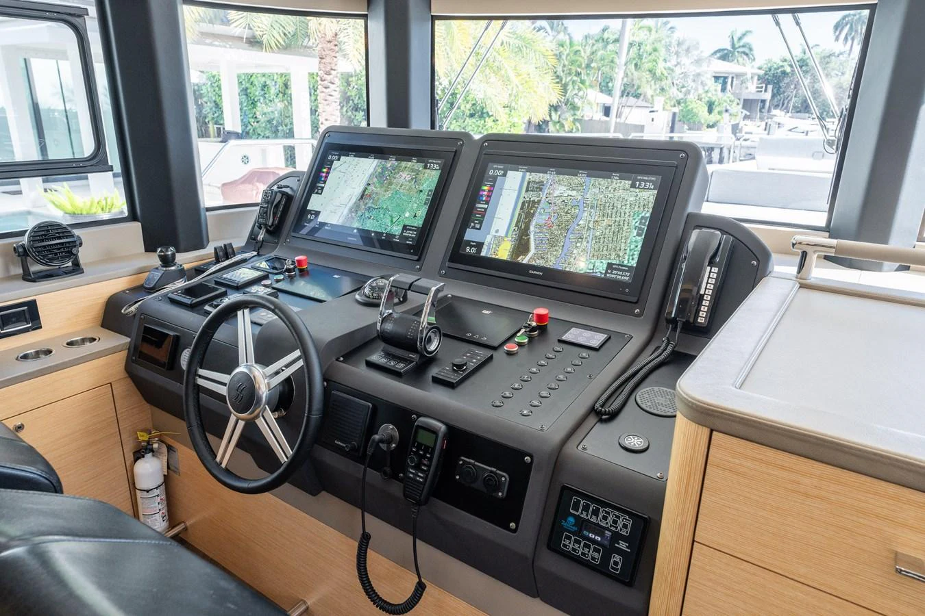 The helm station features advanced navigation systems and a sleek, modern design. aboard FANTASEA Yacht for Sale