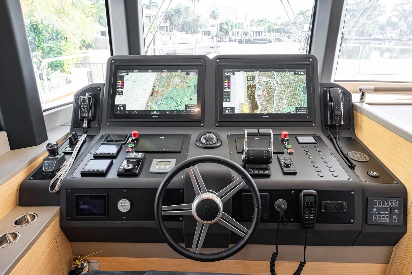 The helm station features advanced navigation equipment and a sleek, modern design. aboard FANTASEA Yacht for Sale