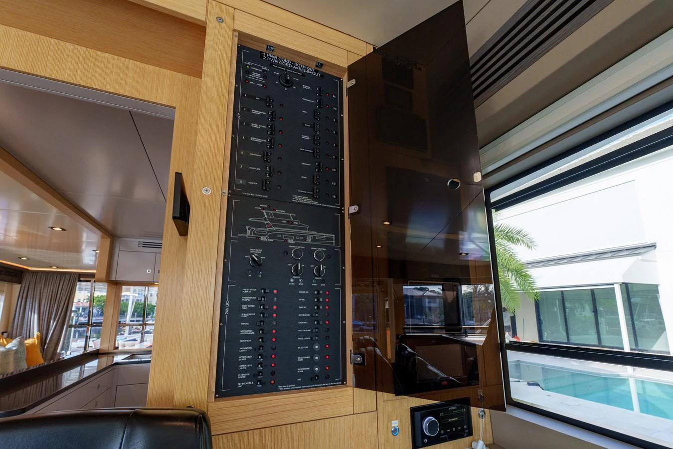 The yacht's control panel is neatly organized and easily accessible, set within a luxurious interior. aboard FANTASEA Yacht for Sale