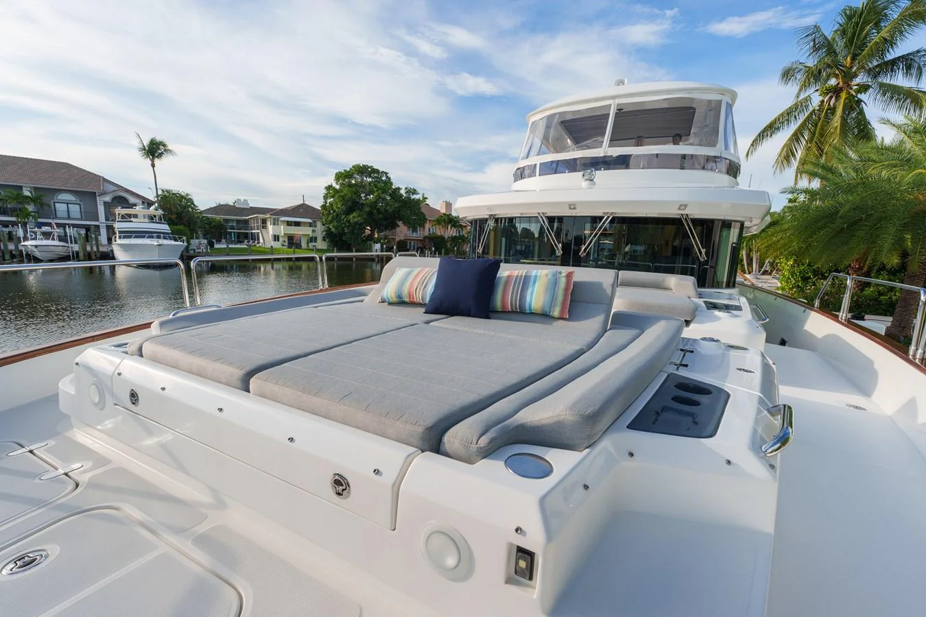 The yacht's foredeck features a spacious sunbathing area with comfortable cushions and pillows, perfect for relaxation. aboard FANTASEA Yacht for Sale