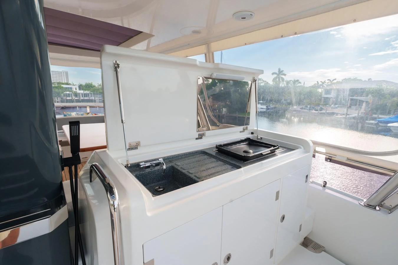 The yacht features a well-equipped outdoor galley with a grill and sink, perfect for alfresco dining. aboard FANTASEA Yacht for Sale