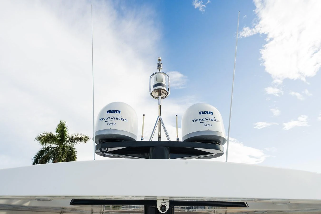 The image showcases the yacht's advanced communication and navigation equipment against a clear sky. aboard FANTASEA Yacht for Sale