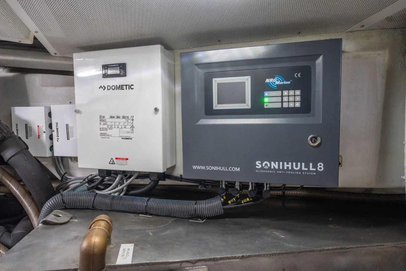 The image showcases the technical equipment and control panels in the yacht's engine room. aboard FANTASEA Yacht for Sale