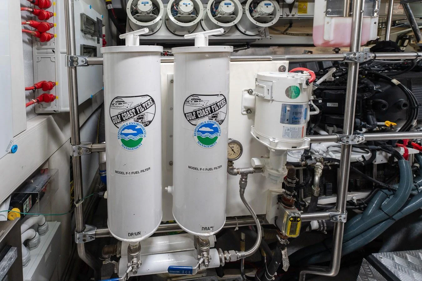 The image showcases the engine room with detailed views of the fuel filtration system and other mechanical components. aboard FANTASEA Yacht for Sale
