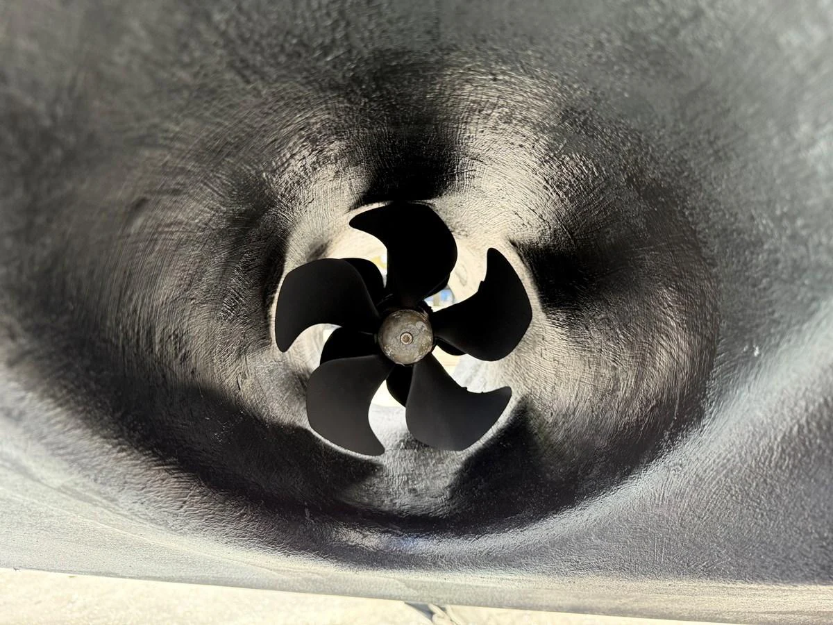 A close-up view of a yacht's bow thruster, showcasing its blades and housing. aboard FANTASEA Yacht for Sale