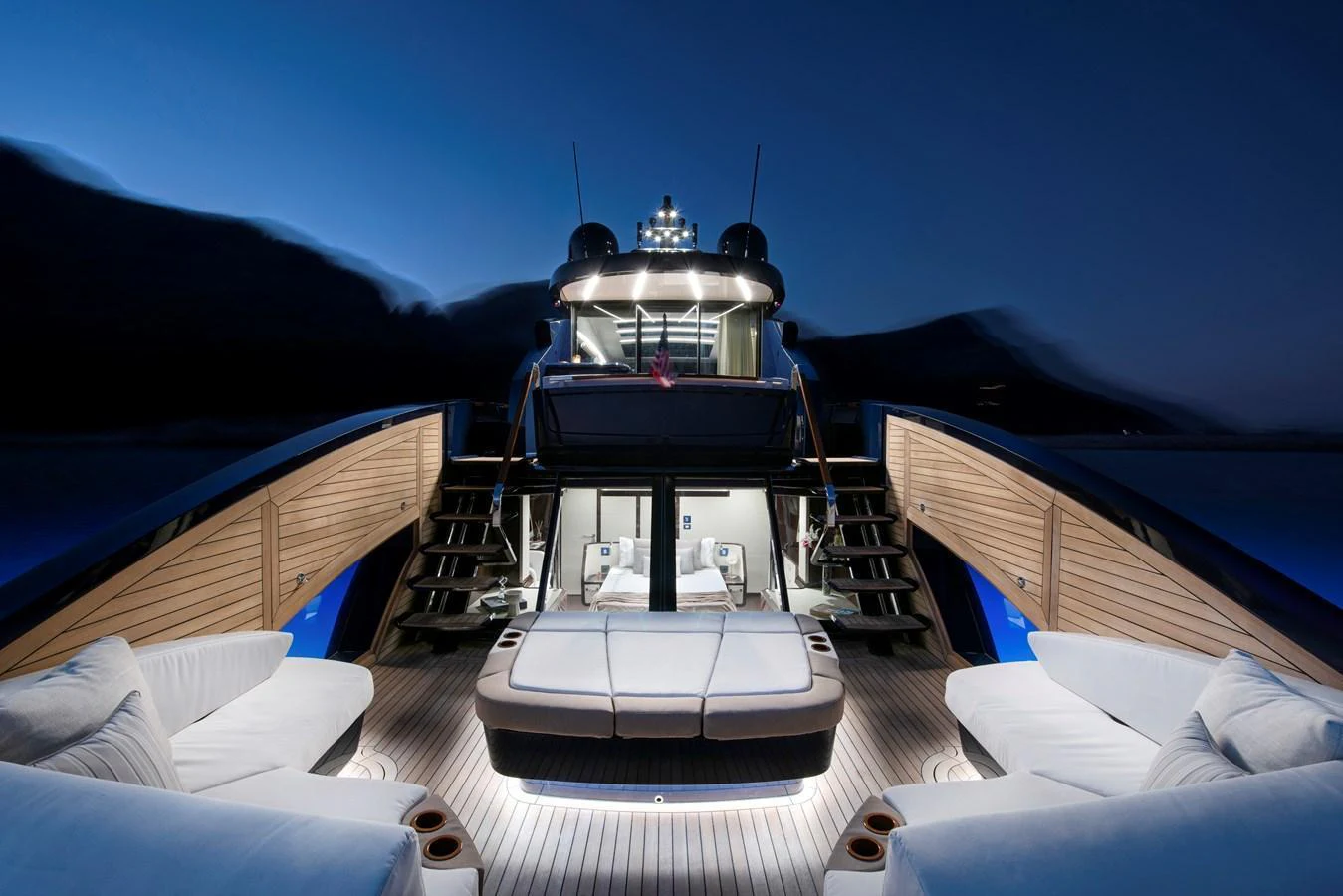 The aft deck of this yacht features luxurious seating and ambient lighting, perfect for evening relaxation. aboard NEW BUILD Yacht for Sale