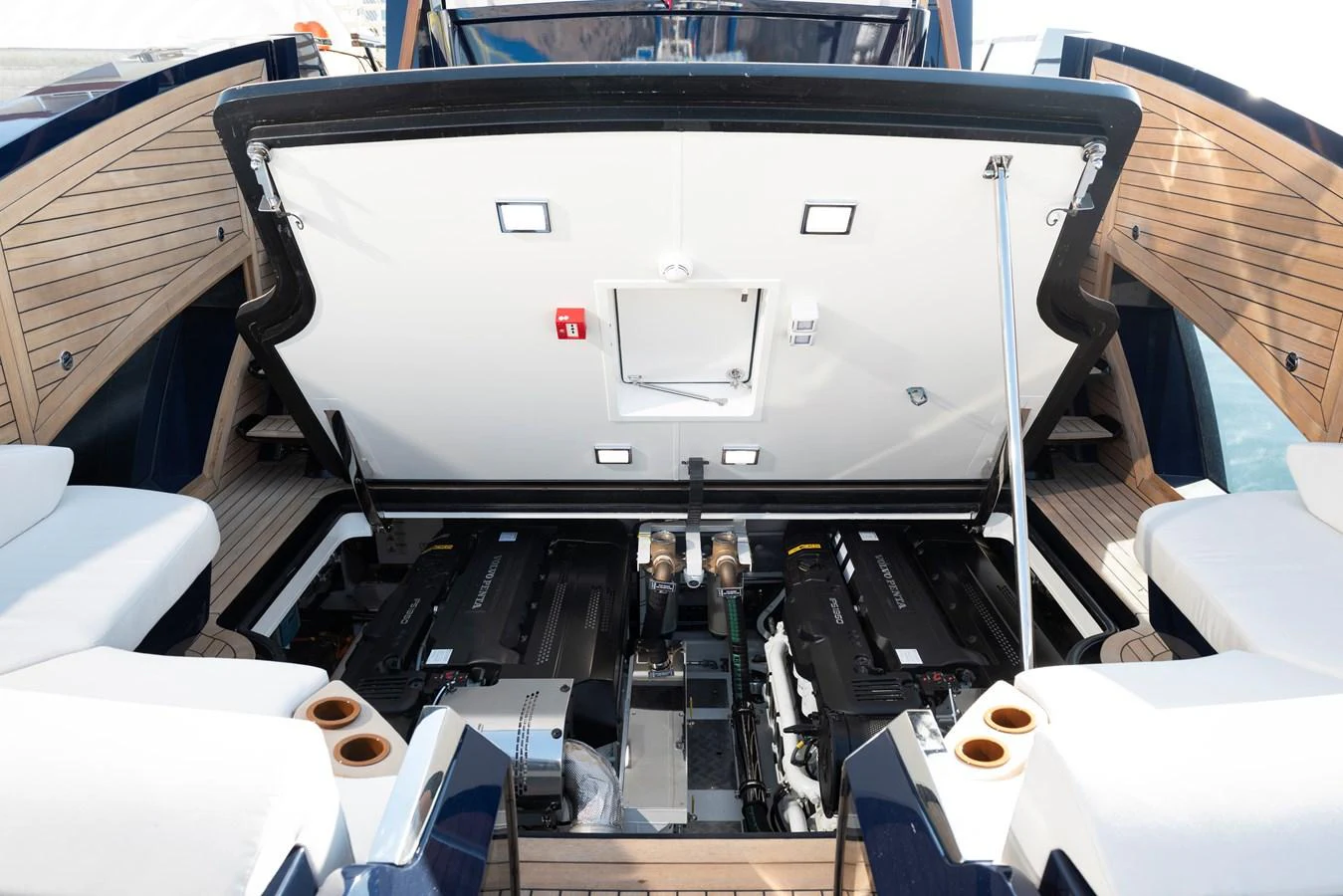 The image showcases the yacht's engine room with the hatch open, revealing powerful engines and a well-organized mechanical layout. aboard NEW BUILD Yacht for Sale