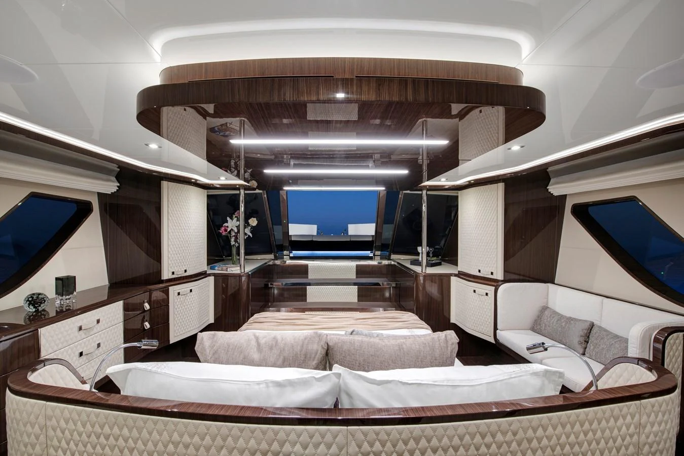 The yacht's salon features elegant wood finishes and plush seating, creating a luxurious and inviting atmosphere. aboard NEW BUILD Yacht for Sale