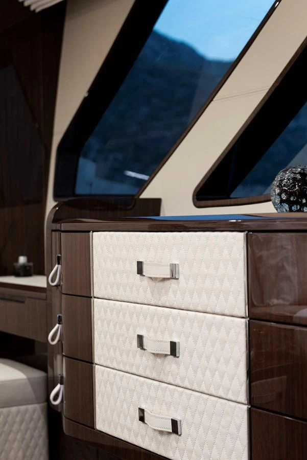 The image showcases a luxurious interior with elegant cabinetry and modern design elements. aboard NEW BUILD Yacht for Sale