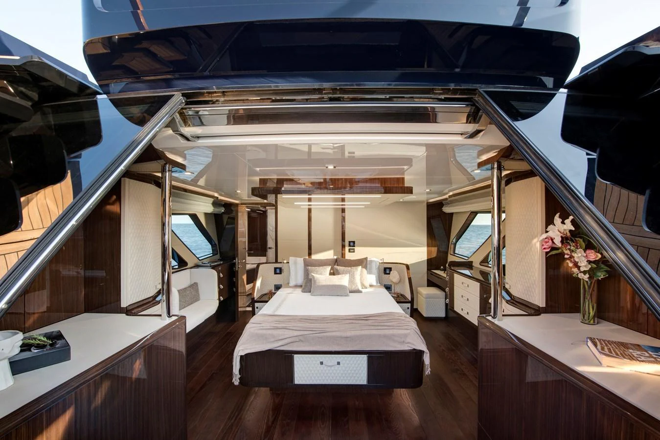 The master stateroom features luxurious wood finishes and expansive windows for a serene retreat. aboard NEW BUILD Yacht for Sale
