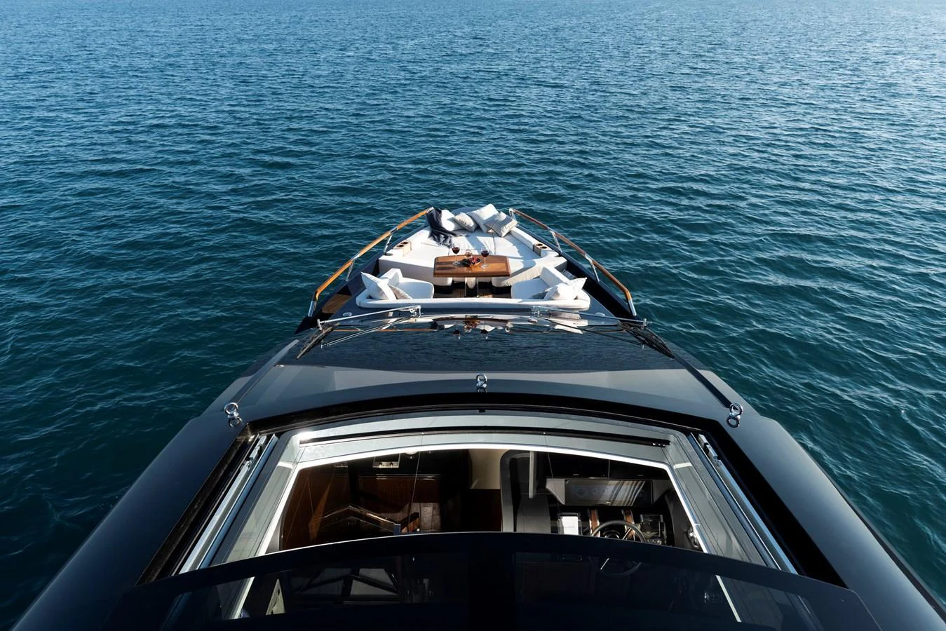 The yacht's foredeck offers a luxurious lounging area with plush seating and stunning views of the open sea. aboard NEW BUILD Yacht for Sale