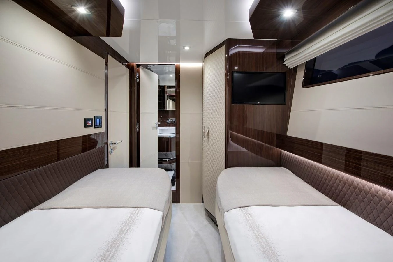 The guest stateroom features twin beds and a sleek, modern design with luxurious finishes. aboard NEW BUILD Yacht for Sale