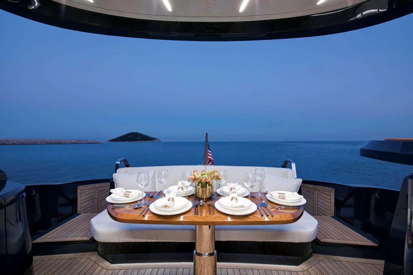 The aft deck features an elegant dining area with a stunning ocean view. aboard NEW BUILD Yacht for Sale